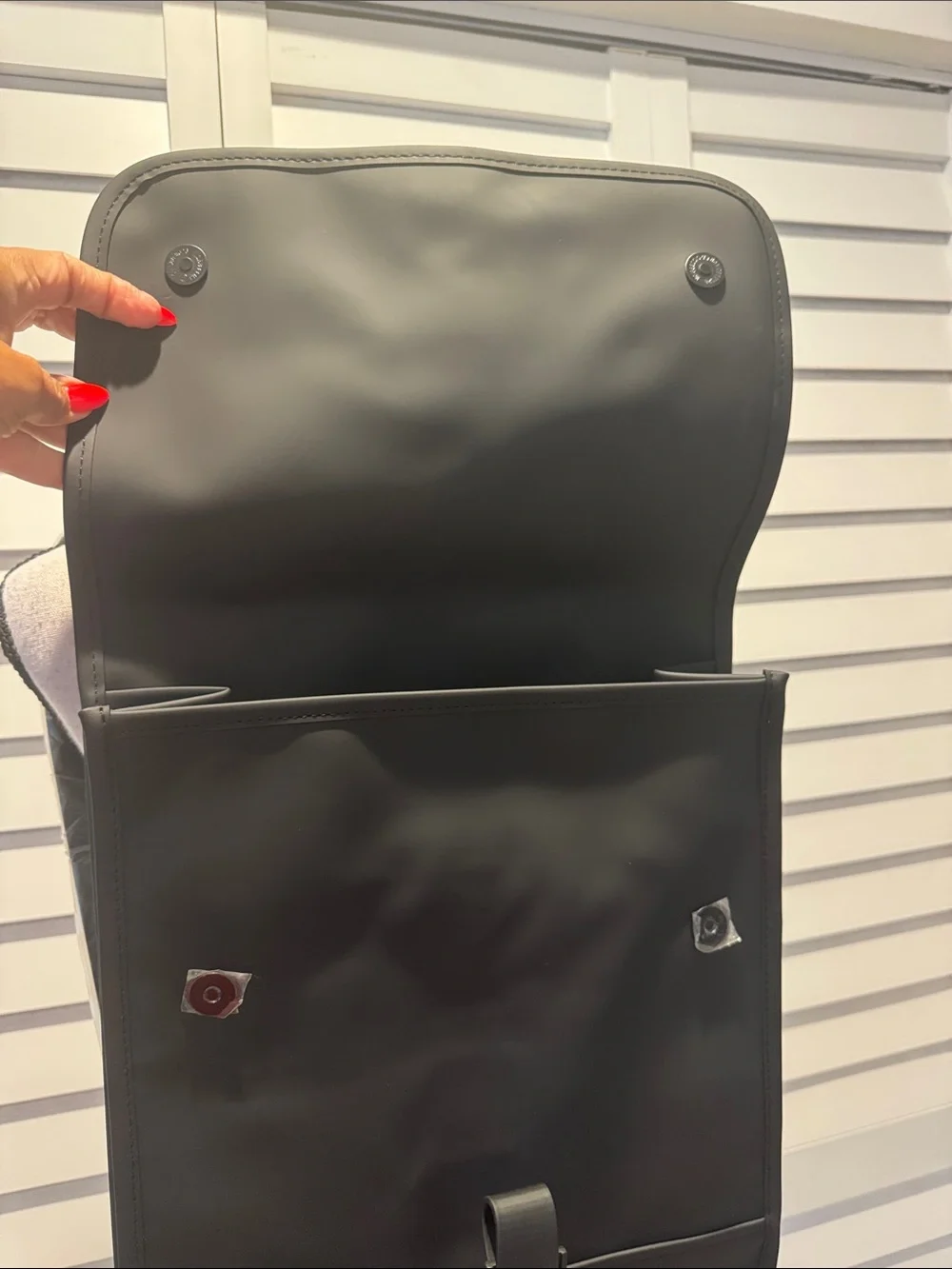 Rains NWT Black Matte Backpack, W/external Back phone pocket, fits a 15” laptop.